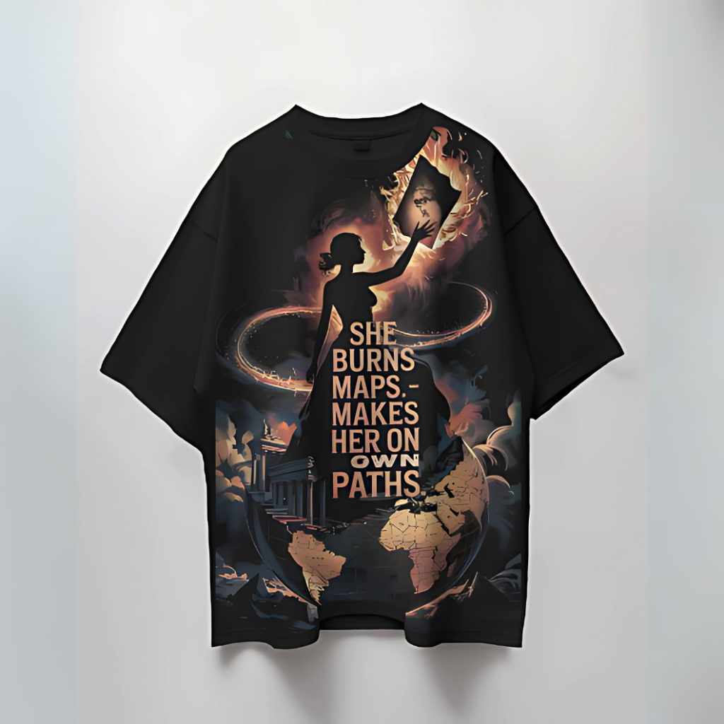 Front view of RealYou “She Burns Maps” oversized t-shirt with bold female empowerment graphic and inspirational quote.