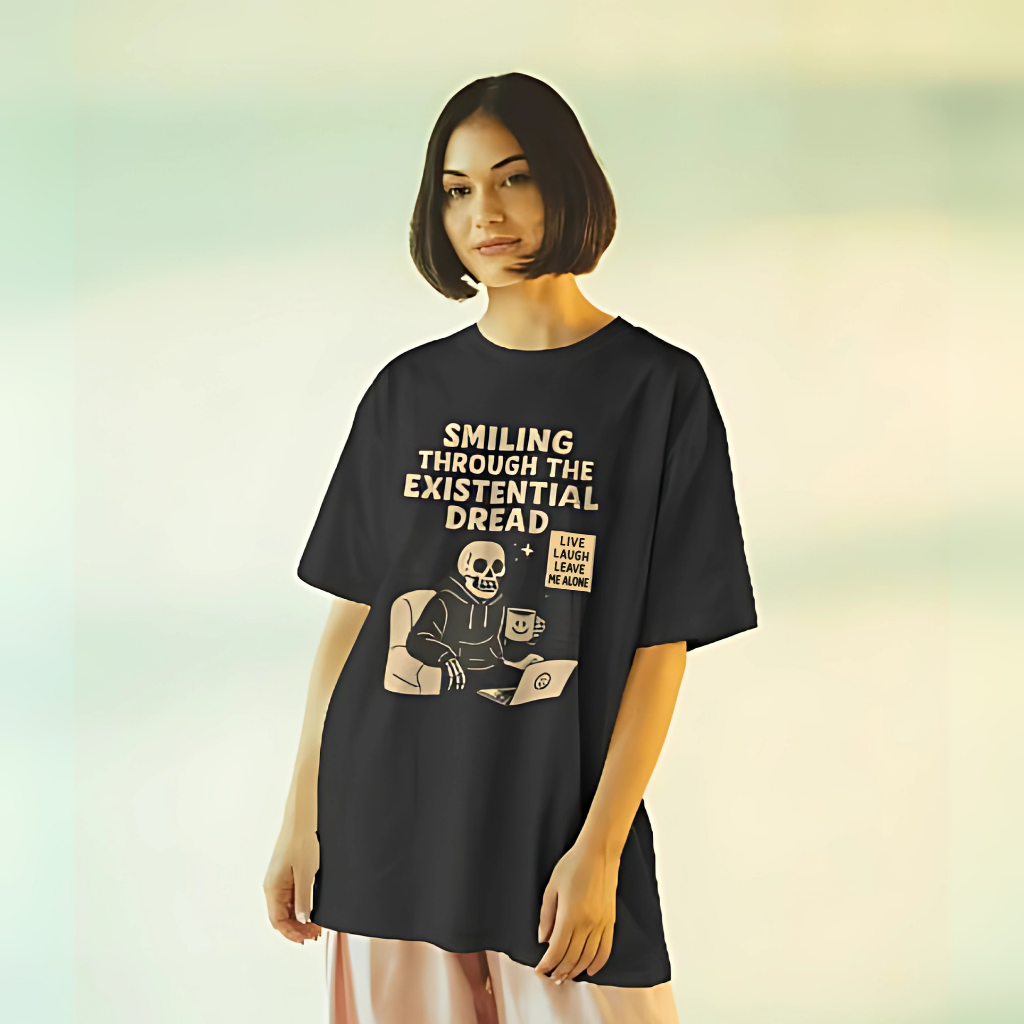 Model wearing RealYou’s “Smiling Through the Existential Dread” oversized skeleton graphic t-shirt.