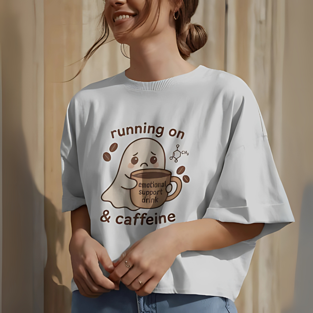 an oversized t-shirt with a cute ghost holding a coffee cup that says “emotional support drink.”