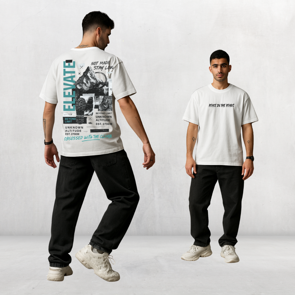 Back of oversized t-shirt with mountain collage artwork, hiking boot print, compass, and motivational text "ELEVATE."