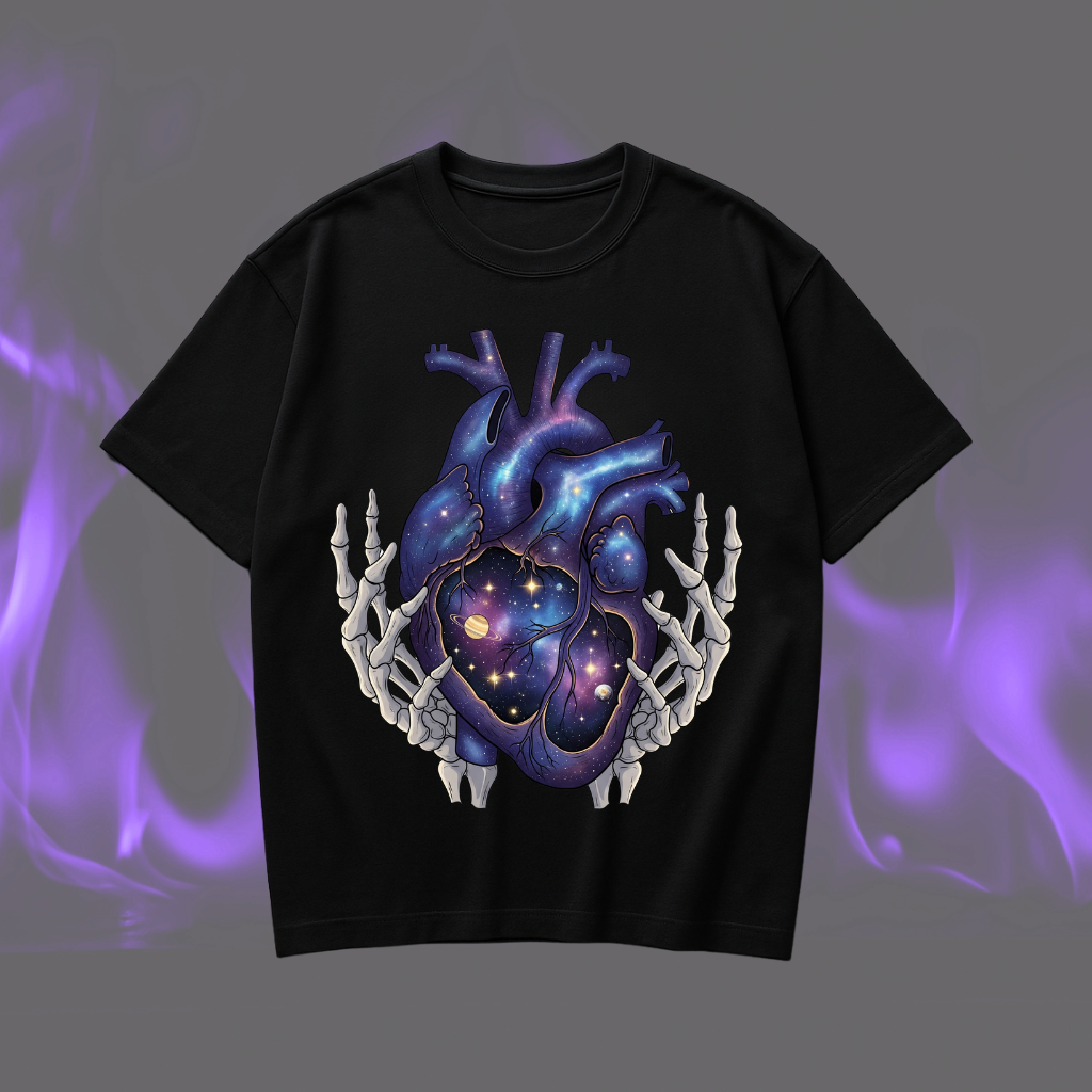 Black oversized t shirt with anatomical heart and planets illustration held by skeleton hands, relaxed fit cotton streetwear tee.